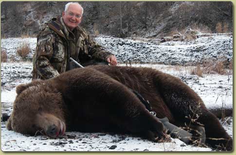 Hunter wih large Kodiak Bear